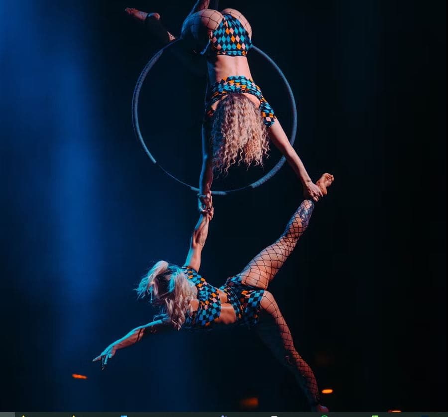 Air Asylum aerial duo performing on a lit hoop