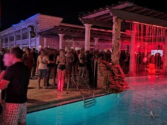 A poolside gathering under string lights at a TampArotic hotel-takeover in Tampa Bay.